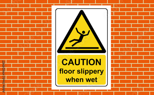 Caution floor slippery when wet sign on a wall