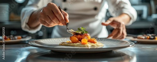 A chef plating a dish in a fine dining restaurant photo