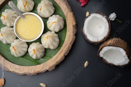 Steamed Modak, white modak, ukdiche modak made from rice flour and coconut jaggery filling. Modak is a traditional Indian sweet made during Ganesh Utsav photo