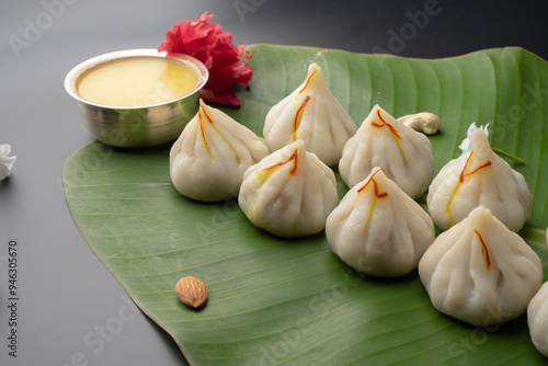 Steamed Modak, white modak, ukdiche modak made from rice flour and coconut jaggery filling. Modak is a traditional Indian sweet made during Ganesh Utsav photo