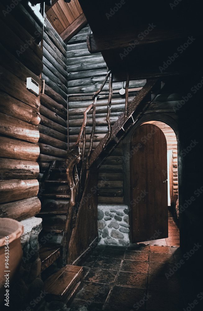 CORDOBA, ARGENTINA, MAY 4, 2022: Mysterious view of wooden cabin with a door letting light passing through CORDOBA, ARGENTINA, MAY 4, 2022: Mysterious view of wooden cabin with a door letting light passing through