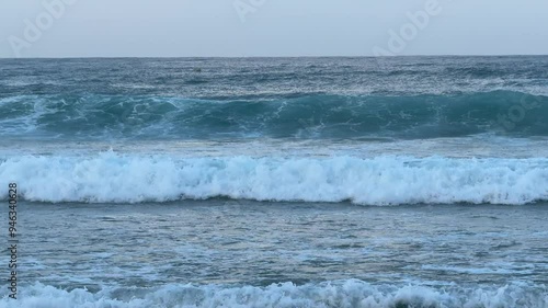 Incekum, Alanya, Turkey 22.08.2024-Sunny Summer Day on Sandy Beach with Wavy Sea in Incekum, Turkey photo