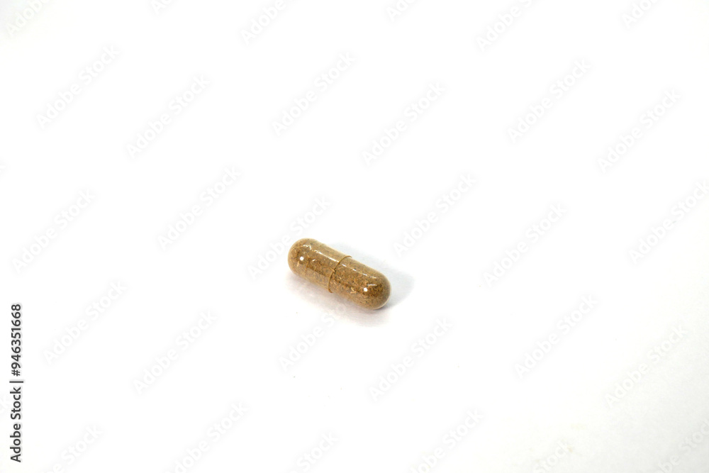 close up of herbal medicine capsule on the white background isolated close up of herbal medicine capsule on the white background isolated