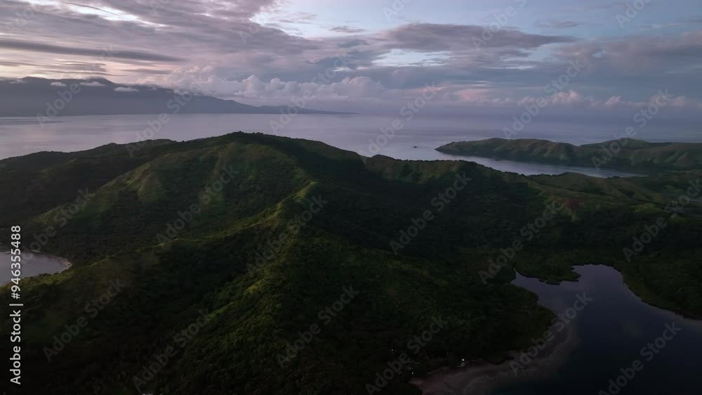 Aerial view of serene Fiji with majestic mountains and calm ocean at sunrise, Fiji. Aerial view of serene Fiji with majestic mountains and calm ocean at sunrise, Fiji.
