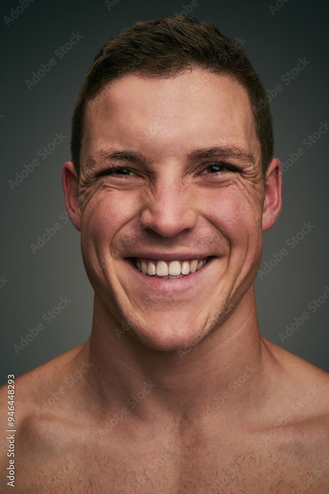 Obraz premium Skincare, happy and portrait of man in studio for wellness, facial treatment and grooming. Dermatology, health and face of person with smile, confidence and pride for natural skin on gray background