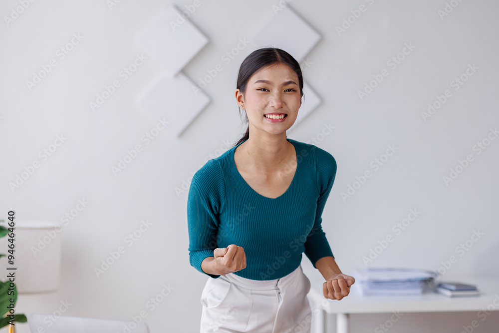 Happy beautiful young Asian freelance business woman standing in workplace office Happy beautiful young Asian freelance business woman standing in workplace office