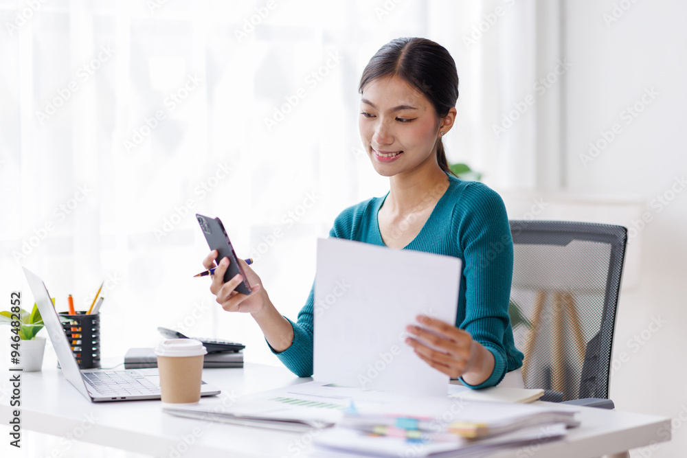 Cheerful business Asian woman freelancer making telephone call share good news about project working in office workplace, business finance concept.
Cheerful business Asian woman freelancer making telephone call share good news about project working in office workplace, business finance concept.