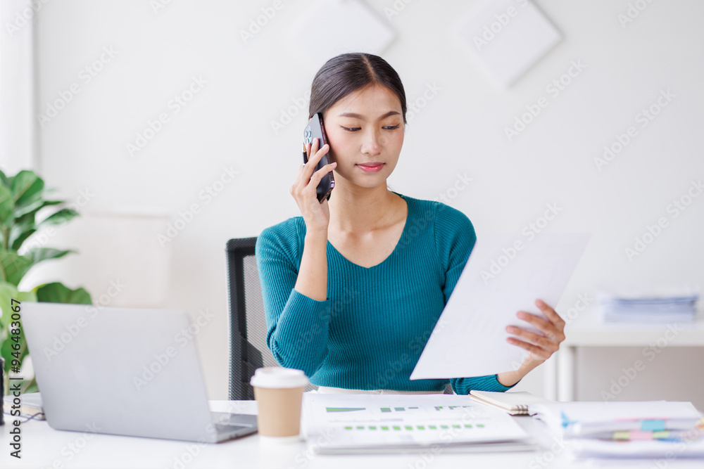 Cheerful business Asian woman freelancer making telephone call share good news about project working in office workplace, business finance concept.
Cheerful business Asian woman freelancer making telephone call share good news about project working in office workplace, business finance concept.