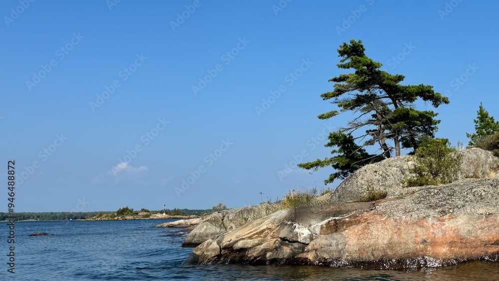 Weathered Granite Rock with lone Pine tree in Georgian Bay Ontario Canada Weathered Granite Rock with lone Pine tree in Georgian Bay Ontario Canada