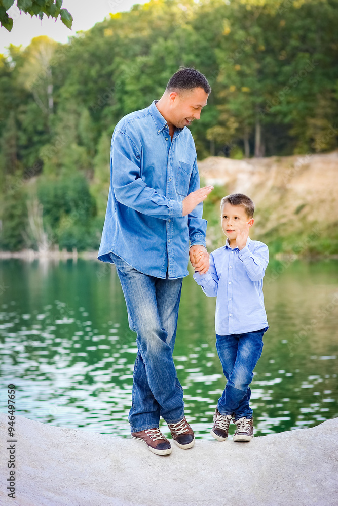 A Happy parent with child on nature in park travel A Happy parent with child on nature in park travel