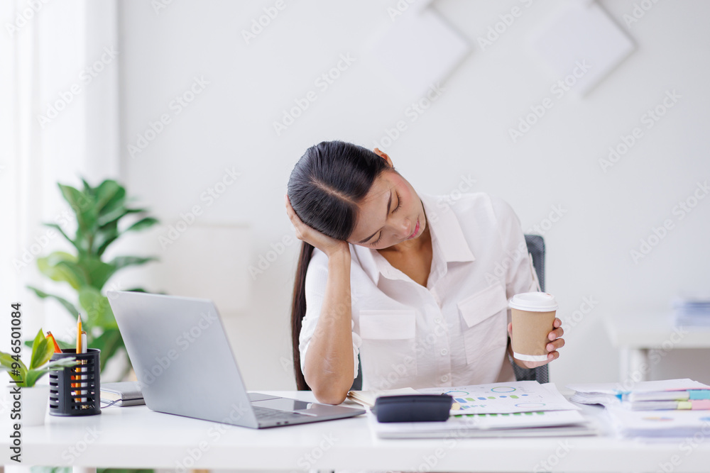 Portrait of tired young business Asian woman work with documents tax laptop computer in office. Sad, unhappy, Worried, Depression, or employee life stress concept. Portrait of tired young business Asian woman work with documents tax laptop computer in office. Sad, unhappy, Worried, Depression, or employee life stress concept.
