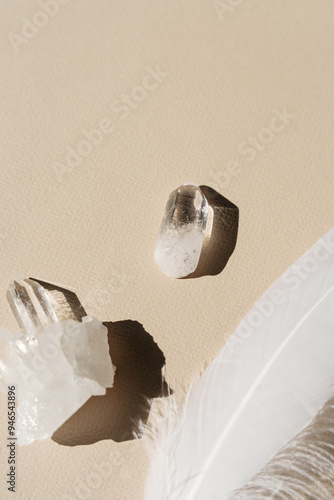 Quartz crystals on beige background, beige miminalist aesthetic, holistic healing and spirituality photo