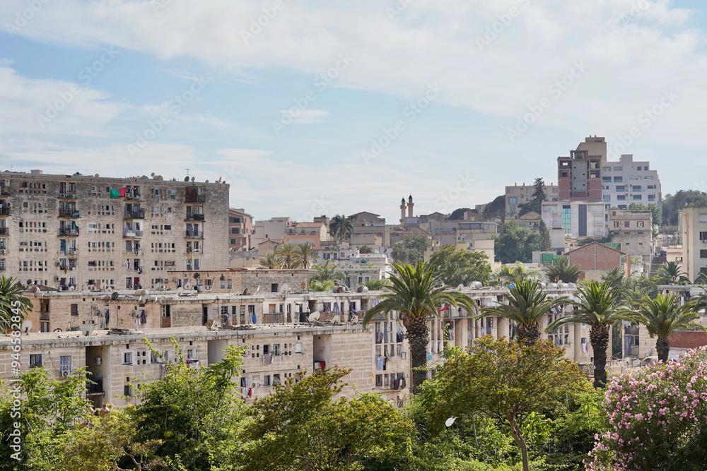 Families live in very close proximity in this residential area of Algiers, landscaped with palm trees in the vicinity of the Monument to Martyrs. Families live in very close proximity in this residential area of Algiers, landscaped with palm trees in the vicinity of the Monument to Martyrs.