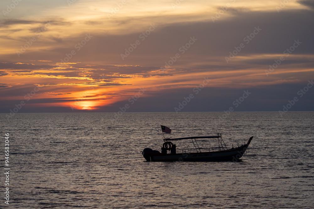 Fishing boat on the sea with sunset background. Fishing boat on the sea with sunset background.