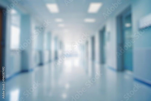 blurred of background. interior of a modern hospital with an empty long corridor. waiting room for patients and families between the corridor with bright white lights. treatment rooms and patient room