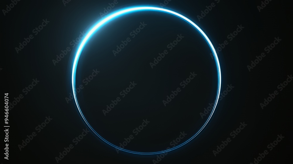 A glowing circular shape with a blue light effect against a dark background. A glowing circular shape with a blue light effect against a dark background.