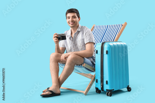 Young man with photo camera...