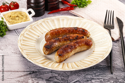 Delicous natural roasted sausages in the plate