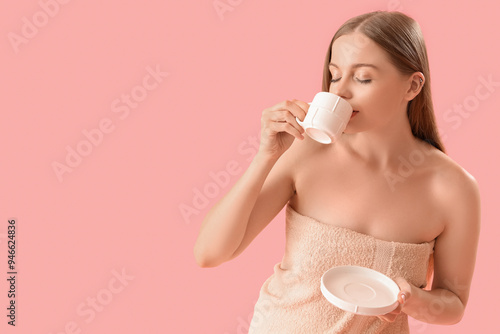 Pretty young woman drinking...