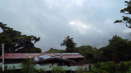 Wallpaper Mural Passing heavy rain and misty drizzle cover the hillside of the Monteverde Cloud Forest with green vegetation in Costa Rica. Torontodigital.ca