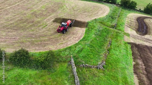 Massey Ferguson 4255 tractor and front loader with an Abbey manure slurry spreader with front loader sowing Artificial Manure fertilizer on a farm in Ireland 22-08-24 photo