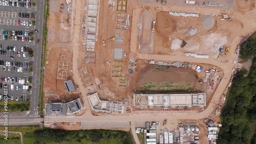 Top-down aerial perspective of a newly built residential development, showing the arrangement of houses and green spaces in Exeter, UK photo