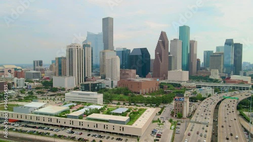 Parallax Drone Shot Downtown Houston in Texas. Aerial Drone City of Houston next to the flow of traffic on Freeway 45. Drone Shoot I45 highway traffic through downtown Houston photo