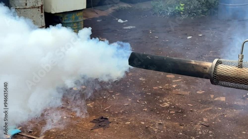 White smoke coming out of a smoke generating machine to exterminate mosquitoes
