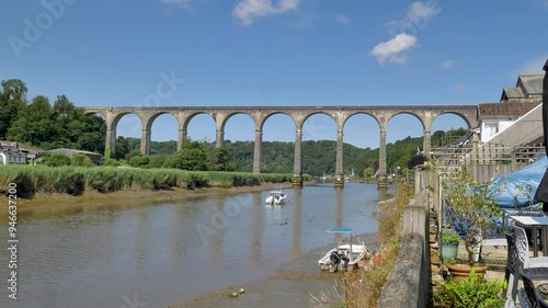 View of the River Tamar flowing through the village of Calstock with the iconic viaduct in the background, showcasing the blend of nature and engineering photo