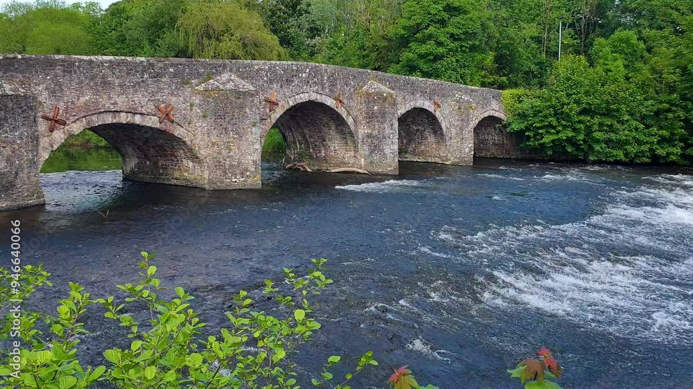 Scenic landscape view of Bickleigh Bridge and Exe River in rural countryside environment near Tiverton in Devon, England UK Scenic landscape view of Bickleigh Bridge and Exe River in rural countryside environment near Tiverton in Devon, England UK