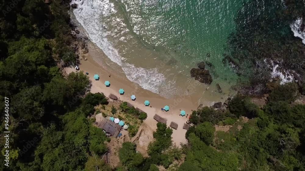 Counterclockwise aerial of a beach with turquoise waters. Counterclockwise aerial of a beach with turquoise waters.
