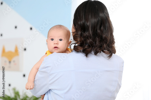 Young woman with her baby i...