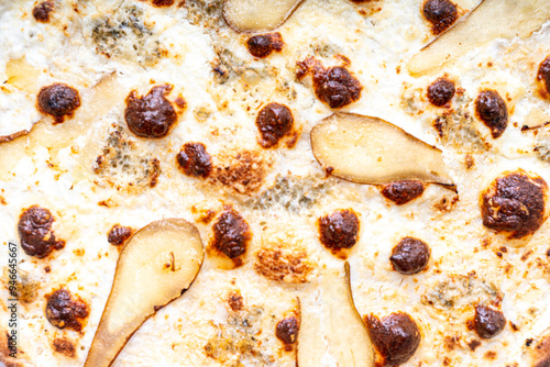 Cheese pizza with pear close-up. Background photo