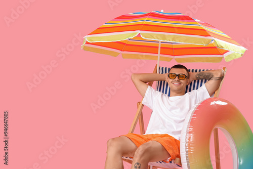 Happy young man with inflat...