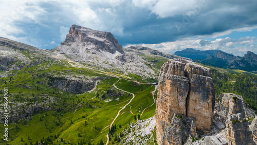 An aerial view of the incredible Cinque Torri mountains in the Dolomites, Italy, captured by a drone. This breathtaking shot showcases the dramatic rock formations and rugged beauty of  mountains photo