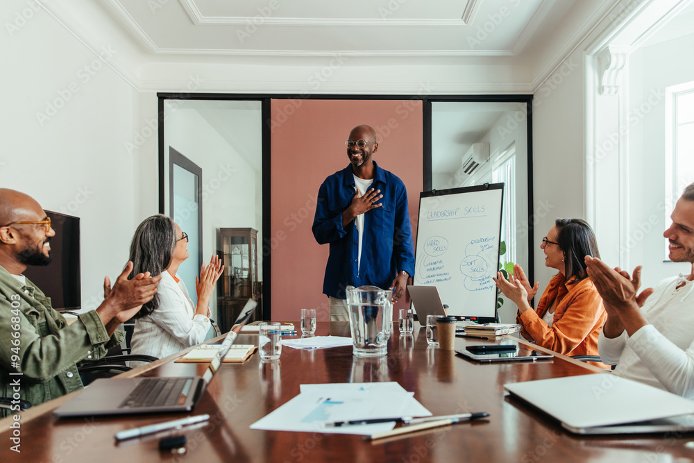 Black man leading a diverse team in a creative meeting, showcasing leadership skills Black man leading a diverse team in a creative meeting, showcasing leadership skills