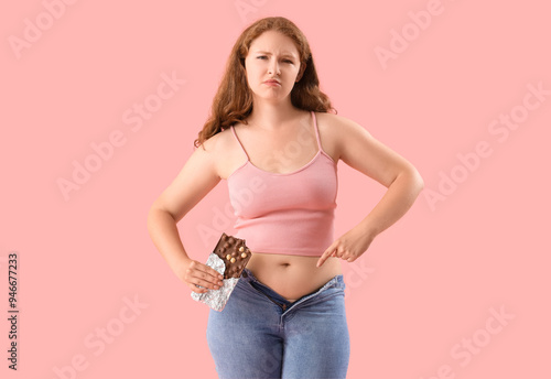 Young woman pointing at bel...