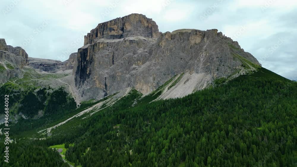 An aerial view of Terrazza delle Dolomiti and the stunning peaks of Gruppo Sassolungo, including Punta Grohmann, Cinque Dita, and Spallone Sassolungo, captured by a drone An aerial view of Terrazza delle Dolomiti and the stunning peaks of Gruppo Sassolungo, including Punta Grohmann, Cinque Dita, and Spallone Sassolungo, captured by a drone