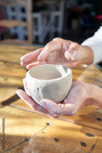 shape clay with hands