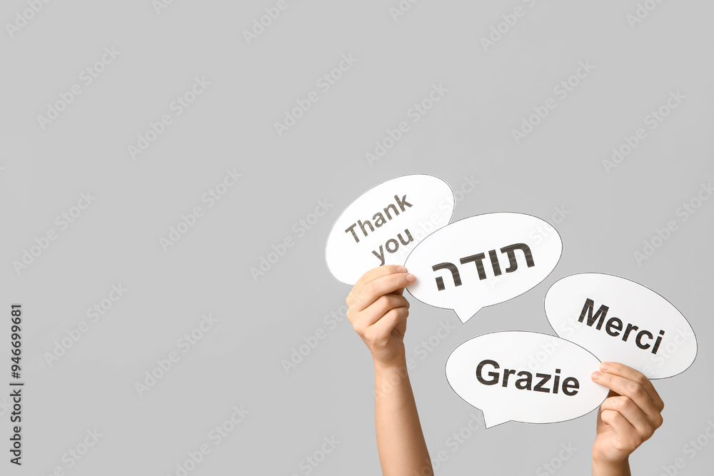 Female hands holding speech bubbles with text THANK YOU in different ...