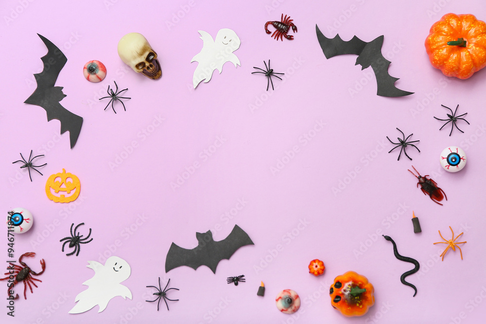 Frame made of different decorations for Halloween on lilac background Frame made of different decorations for Halloween on lilac background