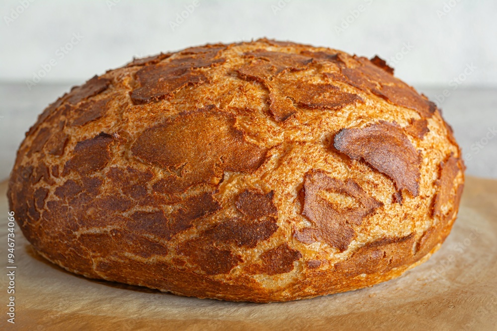 Fresh crispy Tiger (Dutch) bread with a delicious beautiful crust and wonderful homemade taste on a light background. Bakery product with cracks. Fresh crispy Tiger (Dutch) bread with a delicious beautiful crust and wonderful homemade taste on a light background. Bakery product with cracks.