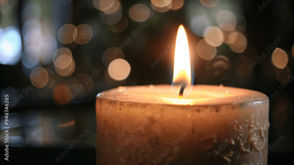 A close-up of a candle burning with a soft, warm glow A close-up of a candle burning with a soft, warm glow