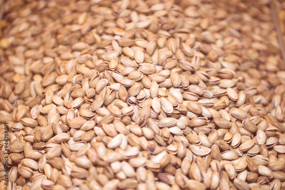 Lots of pistachios, background with tasty nuts. Lots of pistachios, background with tasty nuts.