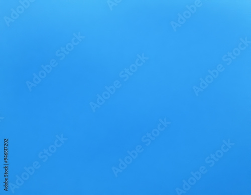 A detailed closeup view of a blue background that has a plain texture