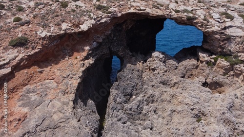 Natural windows in the rocks, Comino Island Malta, Close up drone shot. High quality photo photo