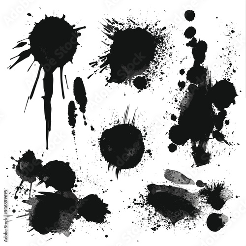 A variety of black ink splatters and stains on a white background, creating an abstract artistic design.