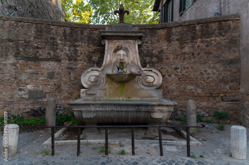 Fontana del Mascherone, ancient granite thermal bath in Via Giulia, Rome, Italy