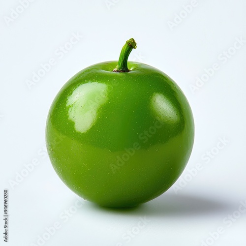 A Single Green Olive on a White Background