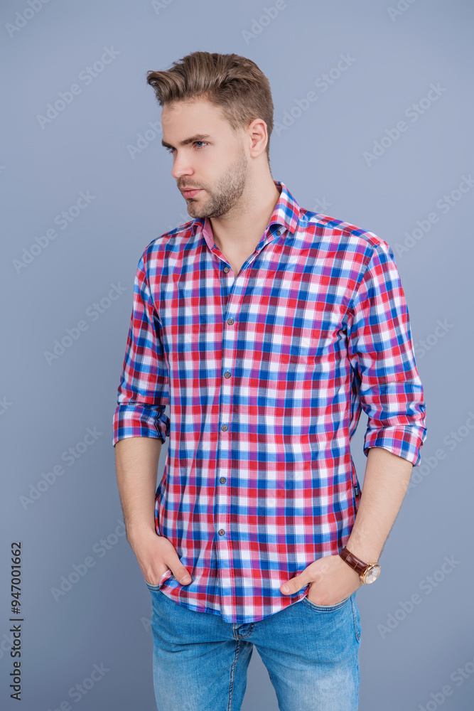 Handsome young man with hairstyle. Trendy male fashion. Male casual style. Skin care and men beauty concept. Caucasian millennial guy. Man in checkered shirt isolated on grey. Male charm Handsome young man with hairstyle. Trendy male fashion. Male casual style. Skin care and men beauty concept. Caucasian millennial guy. Man in checkered shirt isolated on grey. Male charm